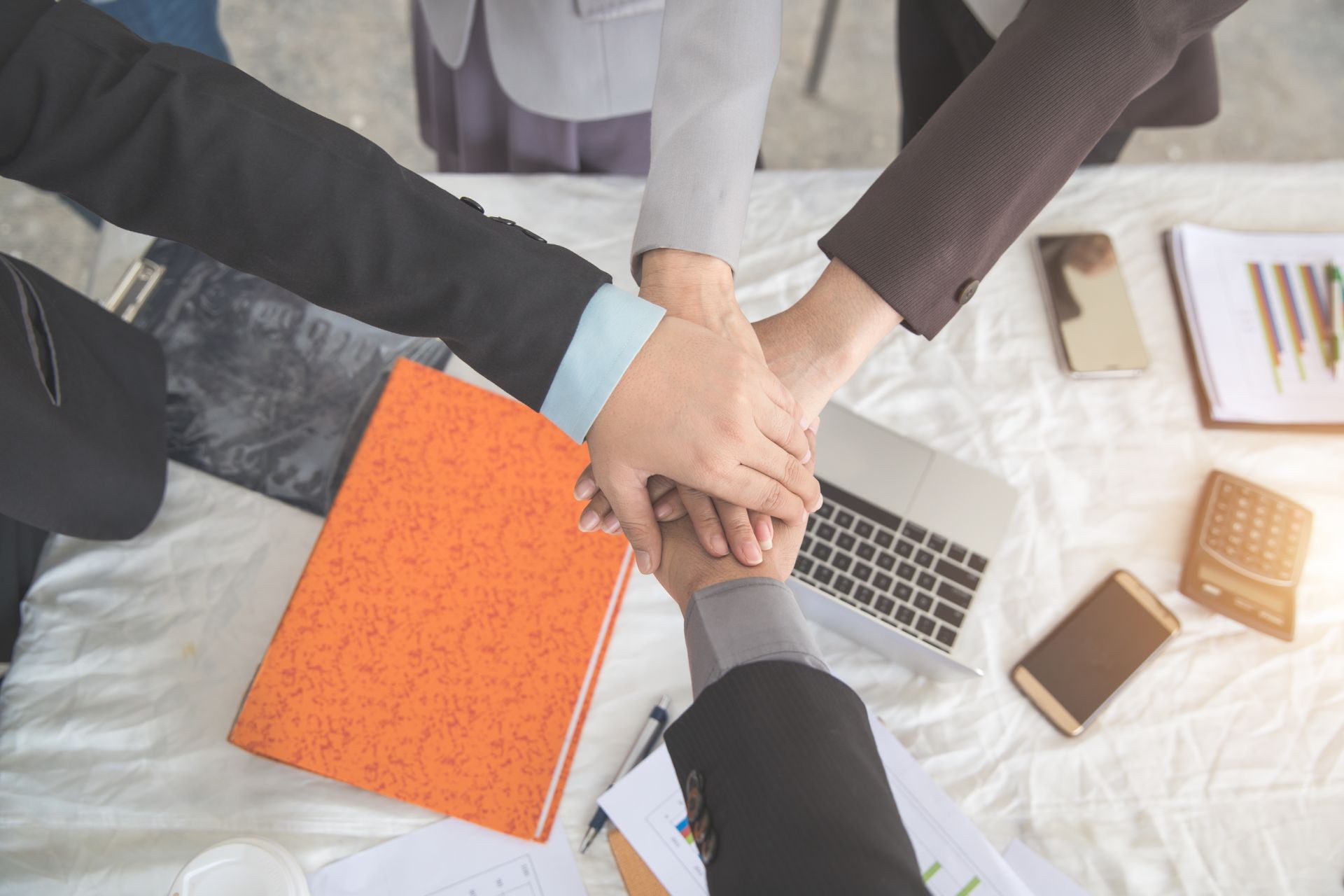 portrait business people hand together using as background (concept of teamwork and partnership)
